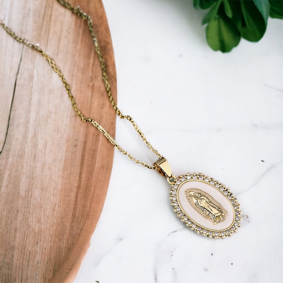 Virgin Mary Pendant Necklace with shell background and delicate crystals surrounded in oval shape